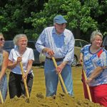 Board members shoveling