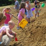 Children and baby shoveling