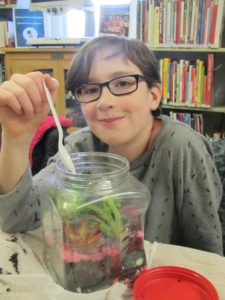 Boy with terrarium