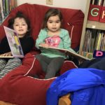 2 little girls reading 