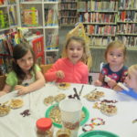 children making treats for birds