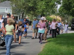 People walking and carrying books.